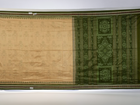 Extreme close-up of cream Sambalpuri silk saree showing exquisite handloom weave texture.