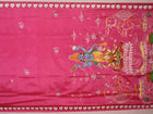 Close-up of pink silk Patachitra saree fabric, showcasing hand-painted texture and fine details.