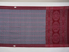Elegant styling of a grey and maroon Sambalpuri cotton saree with hand-woven ikat motifs draped on a model.