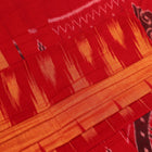 Draped plain yellow Sambalpuri cotton saree with red border.