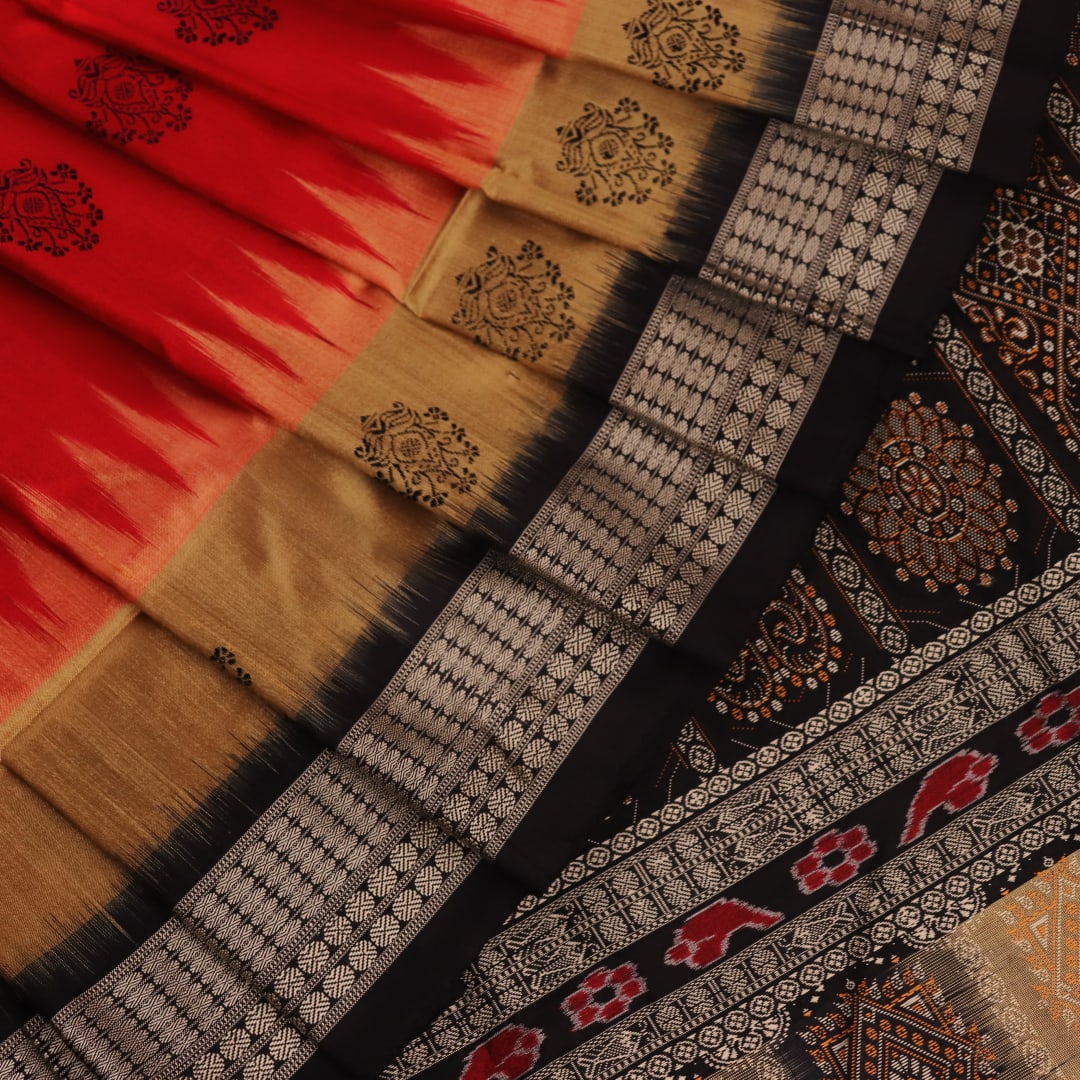 Close-up view of the vibrant and intricate silk fabric texture of a multicolored Bomkai silk saree with a black butta pattern.