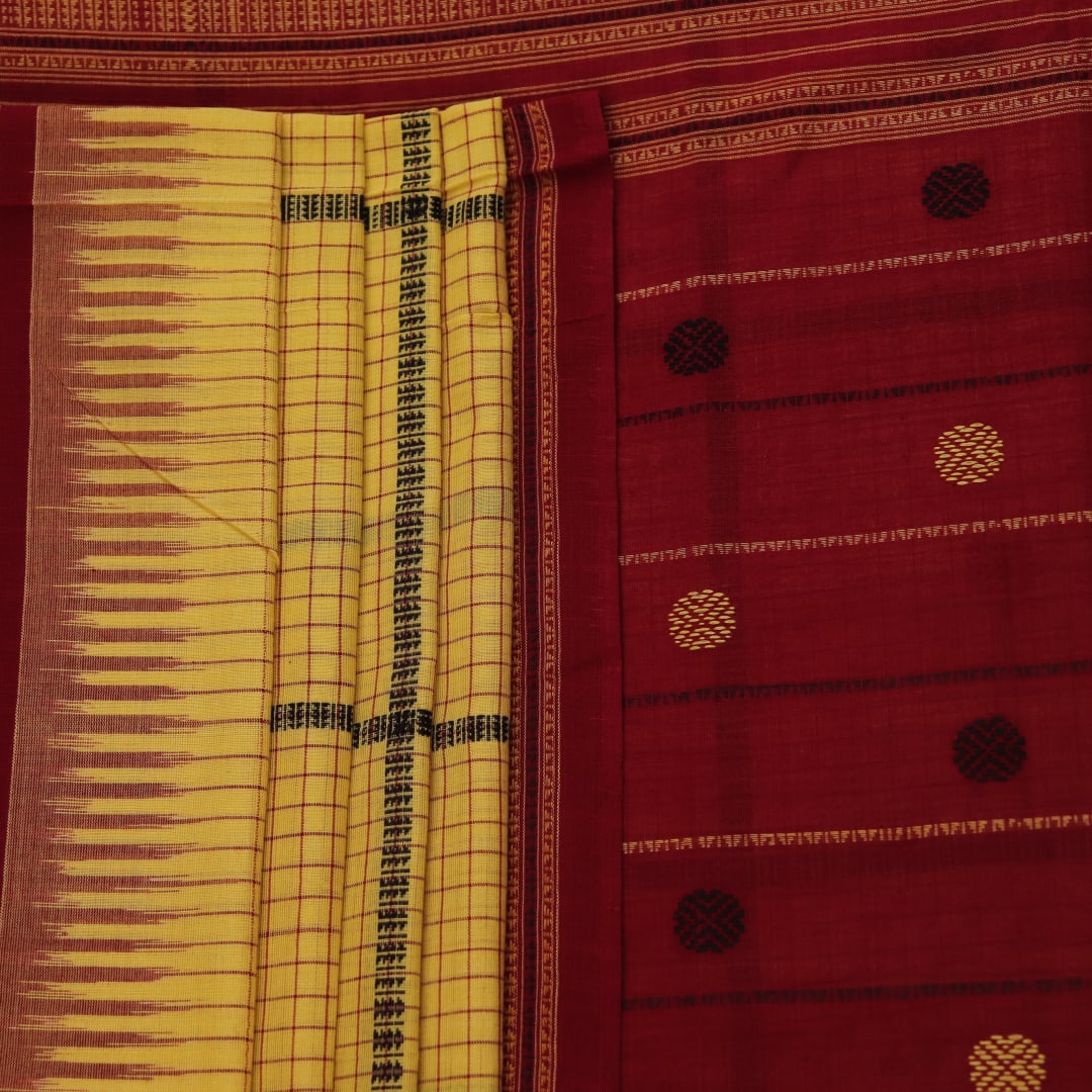 Full view of yellow and maroon cotton Sambalpuri saree featuring a butta pattern.