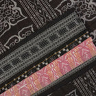 Model wearing a black Sambalpuri cotton saree with multi-color Pasapalli pattern in a full drape.