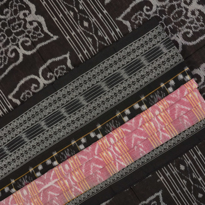 Model wearing a black Sambalpuri cotton saree with multi-color Pasapalli pattern in a full drape.