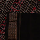 Close-up showing the fine silk texture and intricate motifs of the Sambalpuri saree