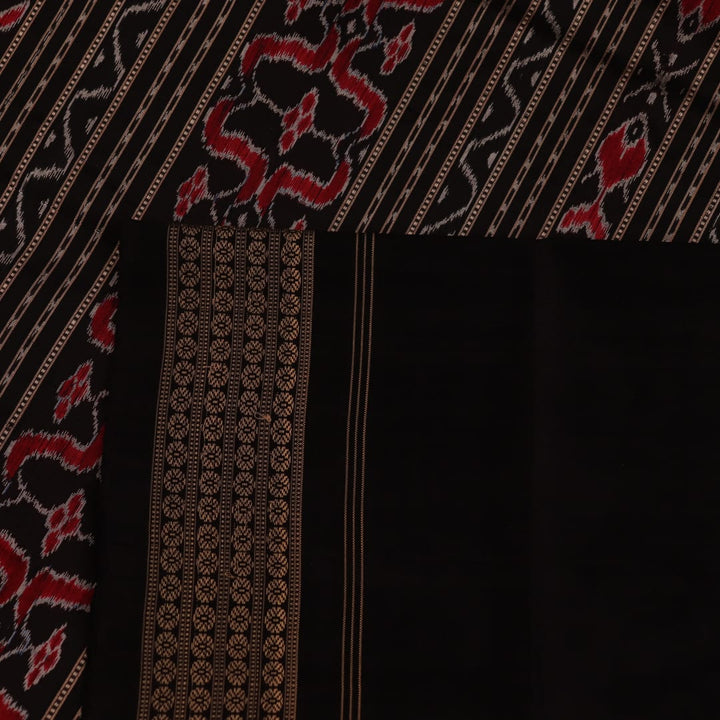 Close-up showing the fine silk texture and intricate motifs of the Sambalpuri saree