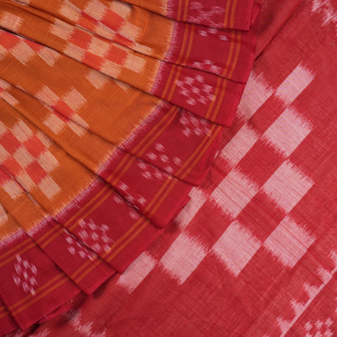 Full drape styling of a brown and maroon Sambalpuri cotton saree with motifs, modeled for elegant look.