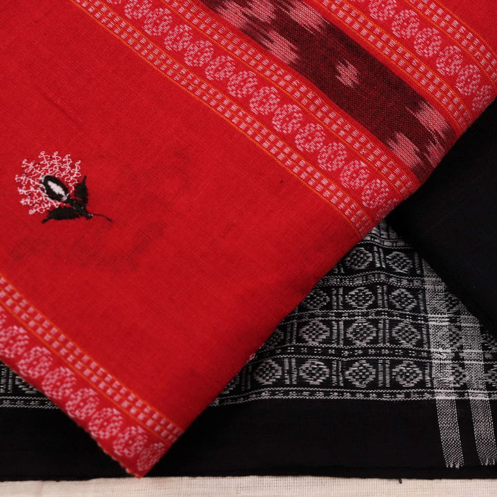 Close-up of red cotton Sambalpuri dress material with intricate black motifs