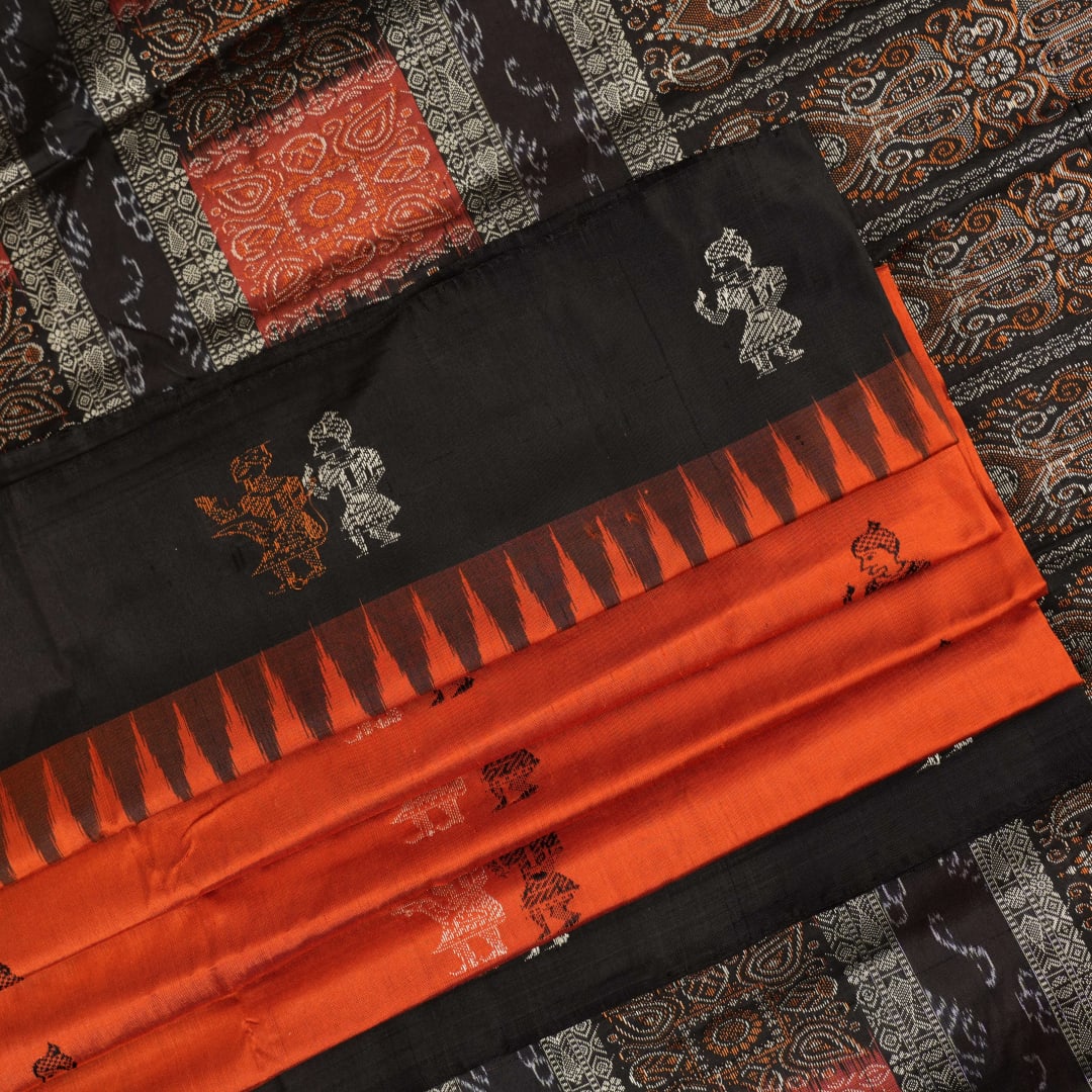 Ultra close-up of Bomkai Silk Saree fabric, revealing intricate handloom texture and butta weave details.