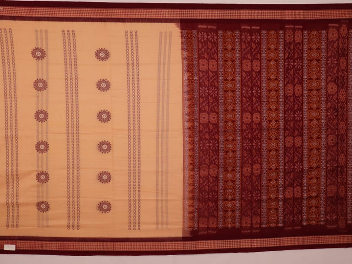 Full view of a cream cotton Bomkai saree with a maroon butta pattern.