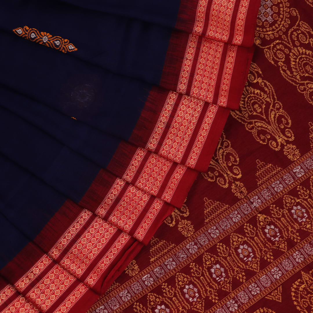 Full view of a blue and maroon Bomkai cotton saree with a butta pattern.