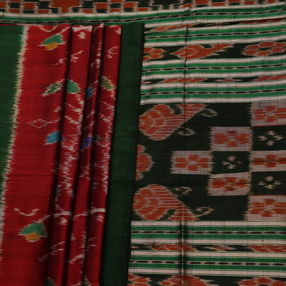 Maroon and green Khandua silk saree with intricate motifs draped elegantly