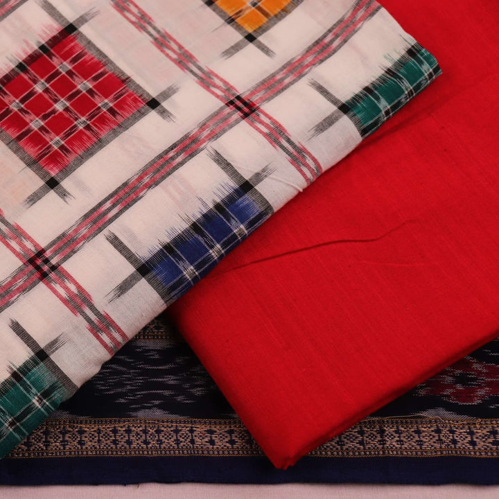 Close-up of white cotton Sambalpuri dress material with red motifs