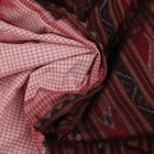 Saree styling: White and black Sambalpuri cotton saree with motifs, draped to showcase the overall look.