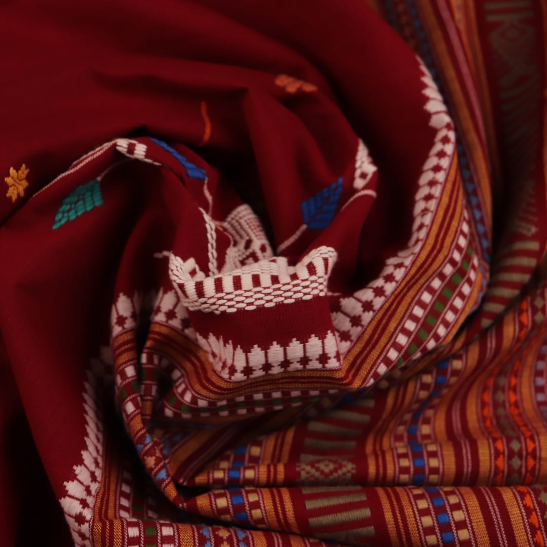 Full view of a maroon and yellow cotton Berhampuri saree with butta pattern.