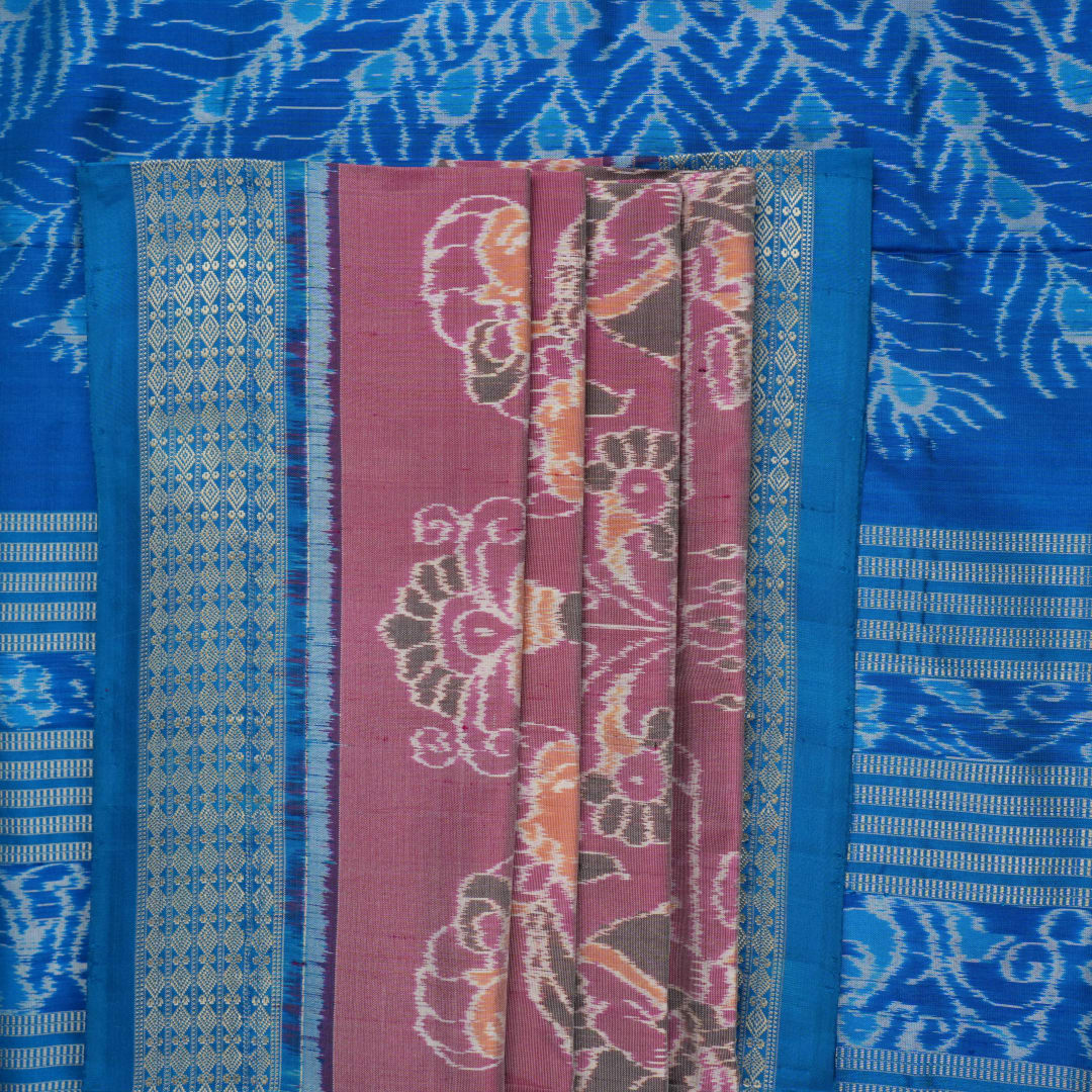 Close-up of the multi-color blue Sambalpuri silk saree fabric texture, highlighting intricate weave.