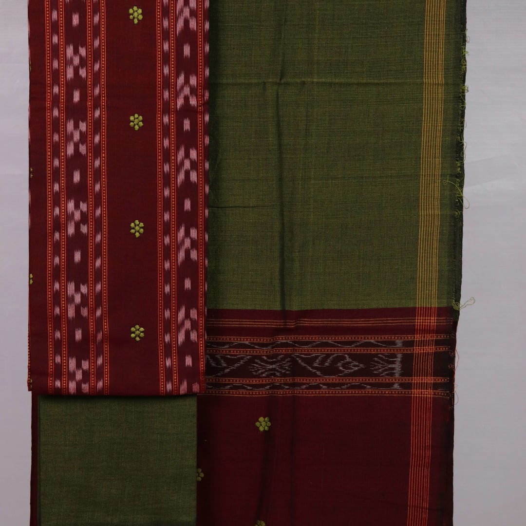 Detail view of the blouse piece with intricate Sambalpuri motifs in maroon and green on cotton fabric.