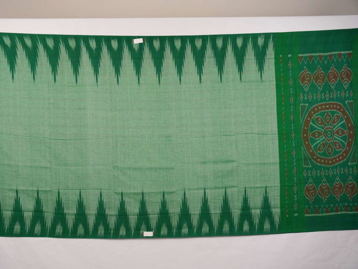 Model wearing a plain green Sambalpuri cotton saree styled elegantly to show the full handloom drape