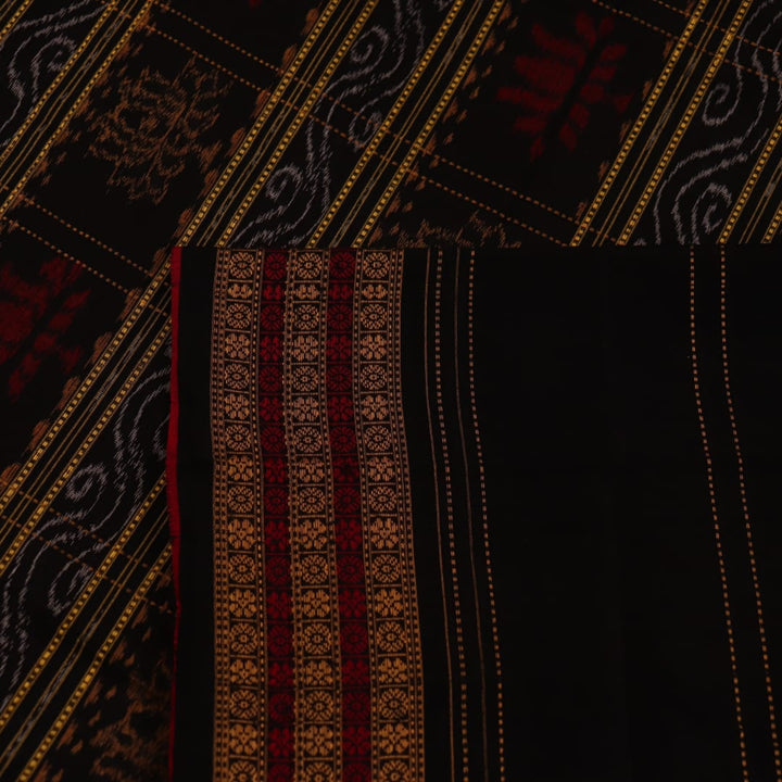 Full view of a black and black cotton Sambalpuri saree with intricate motif patterns.