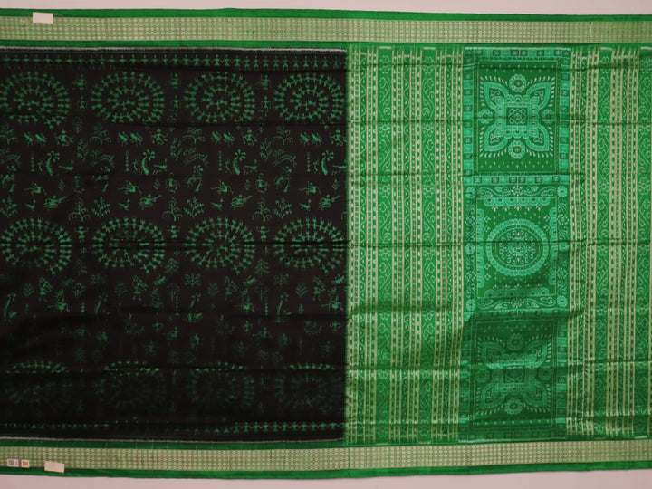 Close-up showcase of the exquisite silk texture with intricate motifs in a black and green Sambalpuri saree.