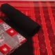 Detail of the grey and black Sambalpuri cotton dress material's blouse piece with motifs.