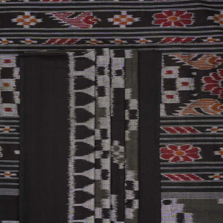 Model wearing a stylish green and black Sambalpuri cotton saree with traditional handloom woven motifs