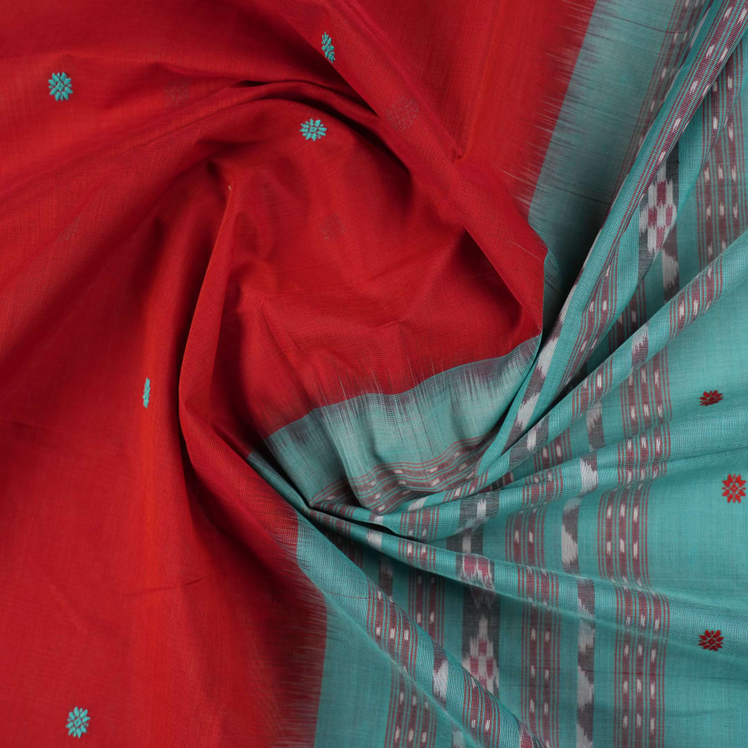 Full flat layout view of the red and green Sambalpuri cotton saree showcasing the butta pattern and borders.