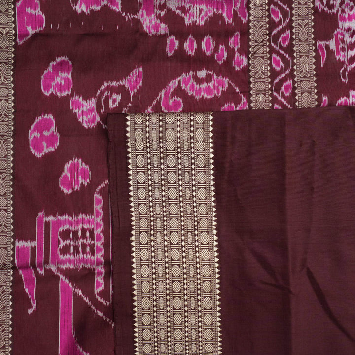 Close-up of the rich multi-color and maroon Sambalpuri silk fabric, highlighting its exquisite handloom weave texture.