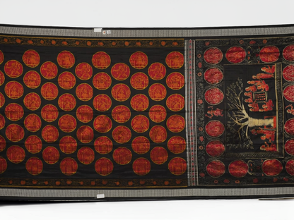Close-up of the luxurious black Sambalpuri silk fabric, highlighting its rich texture and weave.