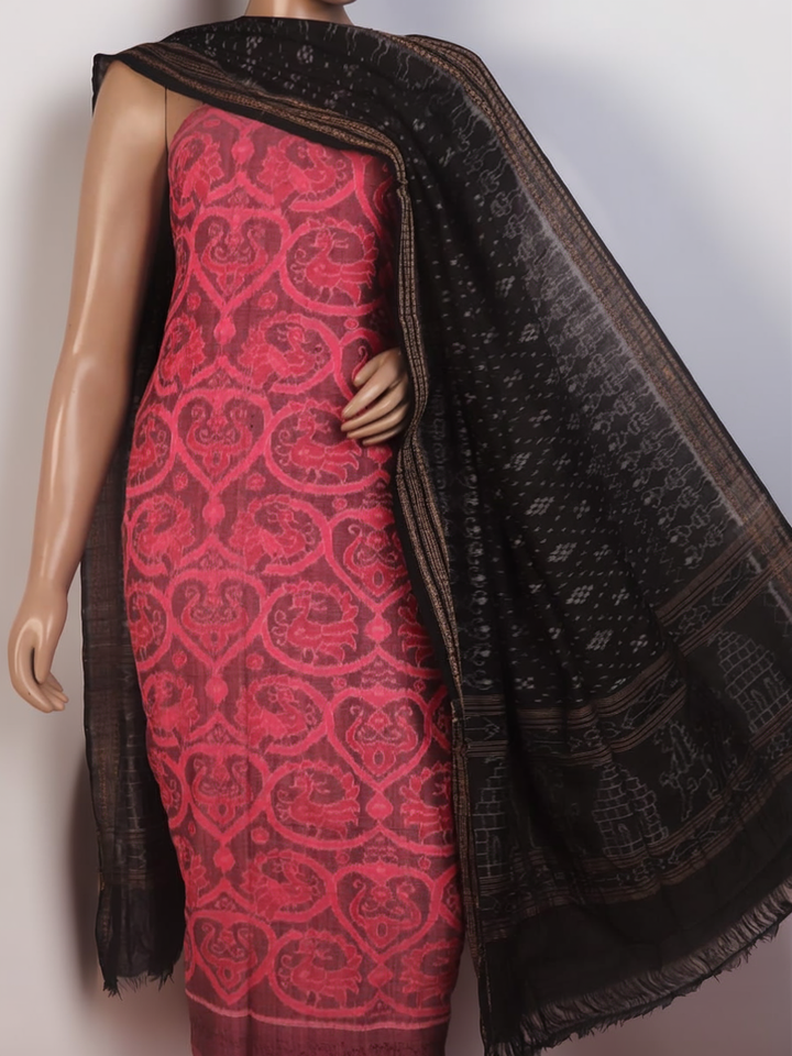 Detail of the pink and black Sambalpuri cotton dress material's blouse piece with motifs.