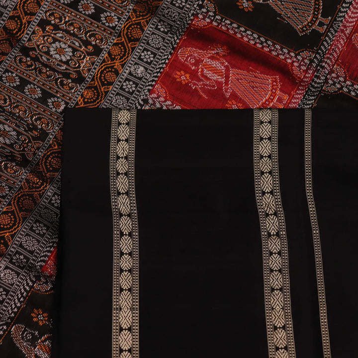 Close-up of maroon silk fabric with delicate butta patterns in black.