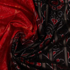Close-up of red and black silk Sambalpuri saree fabric with intricate motifs