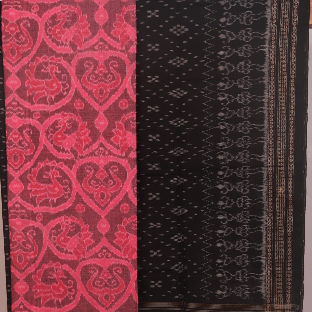 Detail of the pink and black Sambalpuri cotton dress material's blouse piece with motifs.