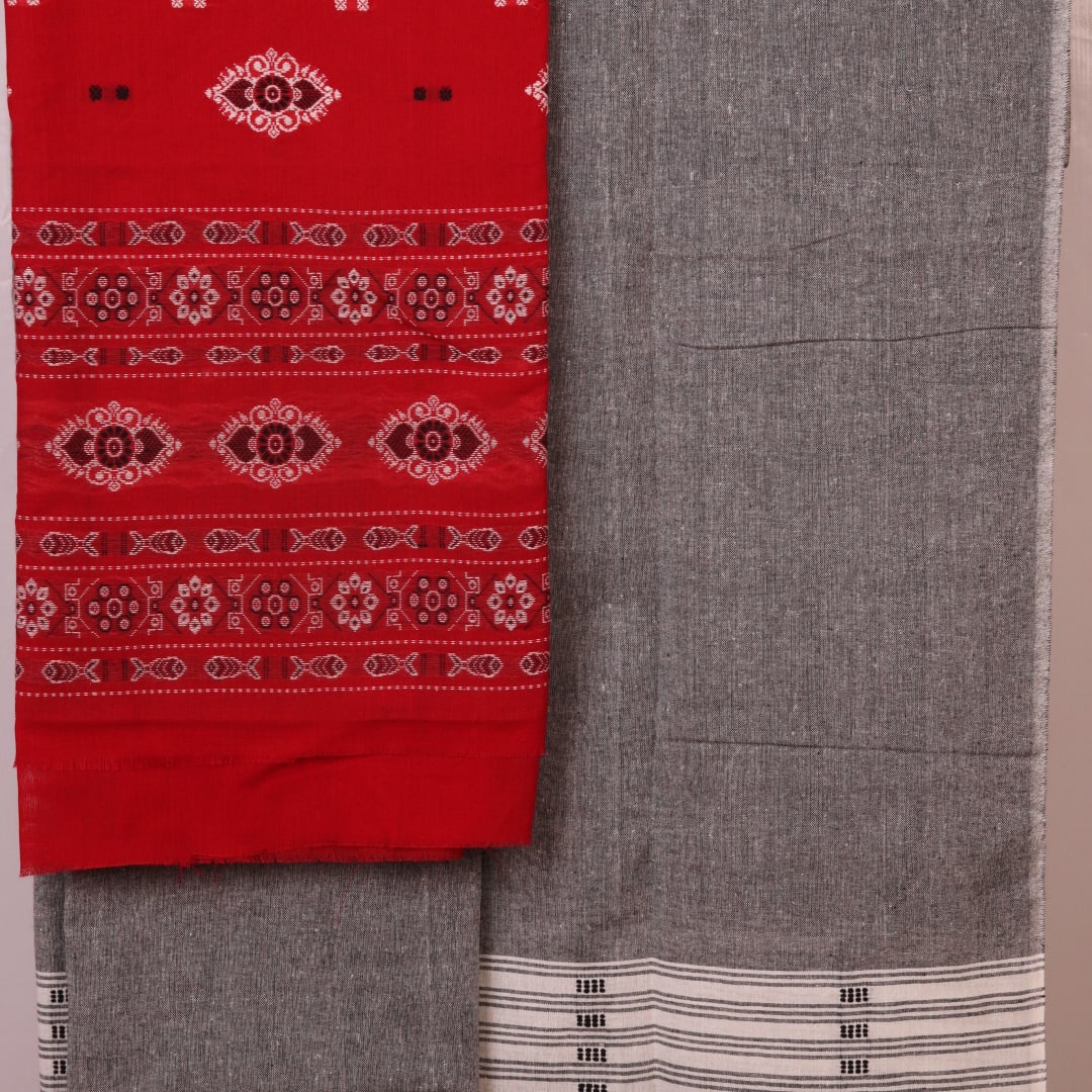 Close-up of the red and grey Bomkai cotton blouse piece with subtle pattern.