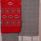 Close-up of the red and grey Bomkai cotton blouse piece with subtle pattern.