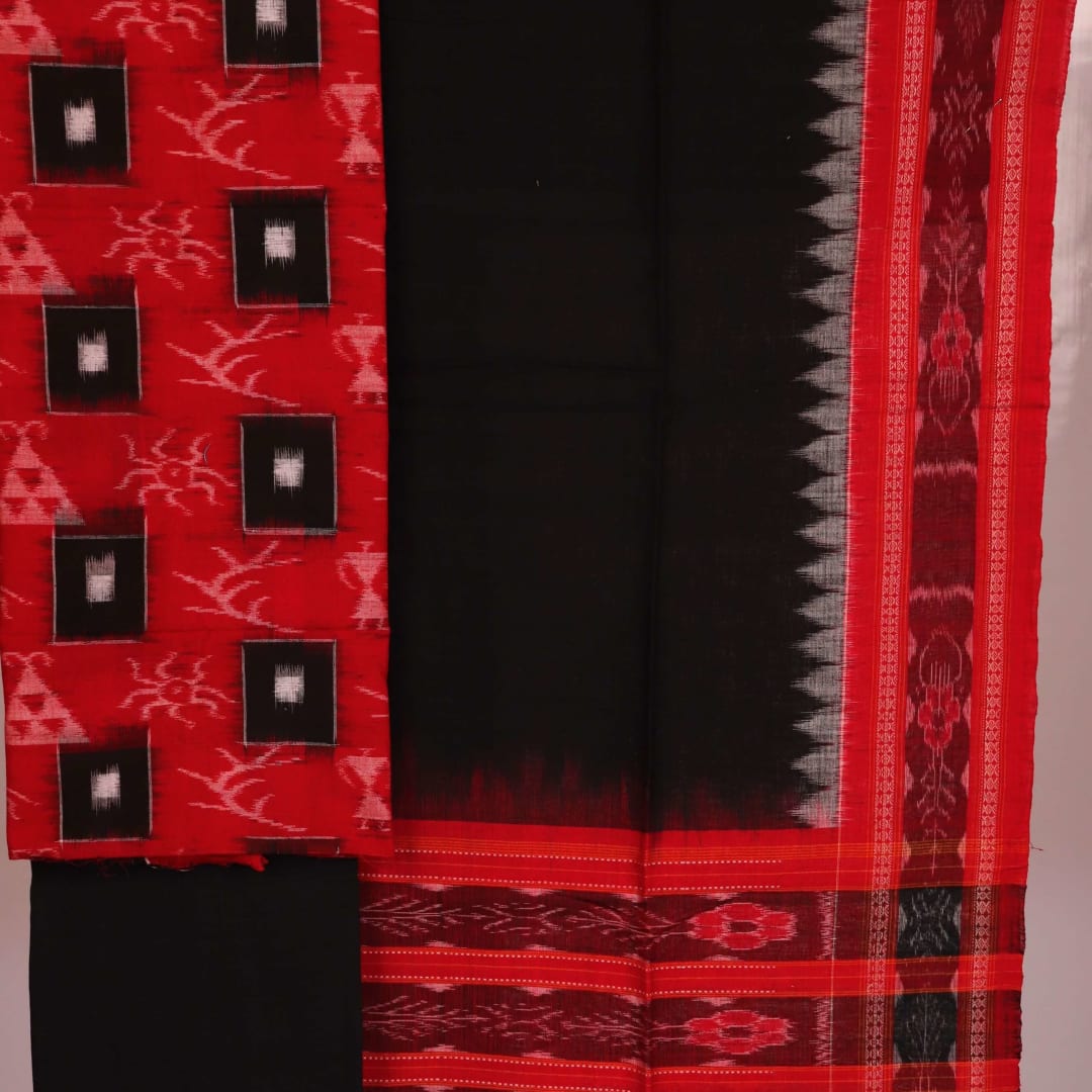 Close-up detail of motifs on a red and black cotton Sambalpuri dress material