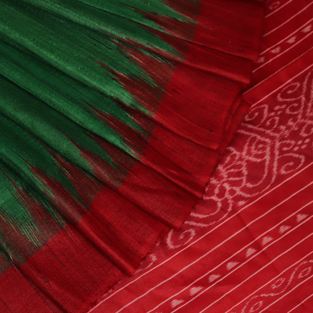 Close-up of green and red tussar silk saree fabric texture