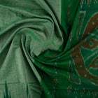 Model wearing a plain green Sambalpuri cotton saree styled elegantly to show the full handloom drape