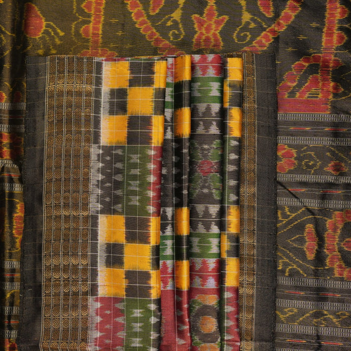Extreme close-up of Sambalpuri Silk Saree fabric, revealing multi-color brown weave and tissue texture.
