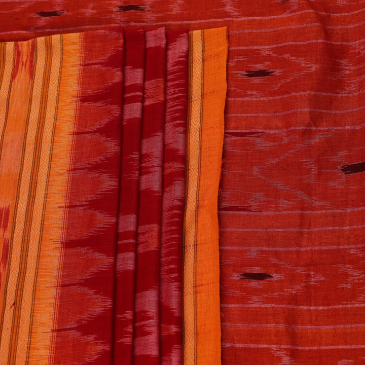 Red and yellow Sambalpuri cotton saree with motifs, elegantly draped to showcase its style.