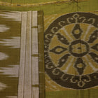 Plain green Sambalpuri cotton saree, showcasing elegant drape.