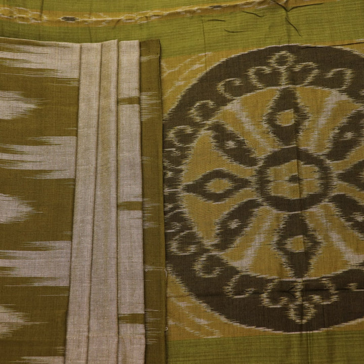Plain green Sambalpuri cotton saree, showcasing elegant drape.