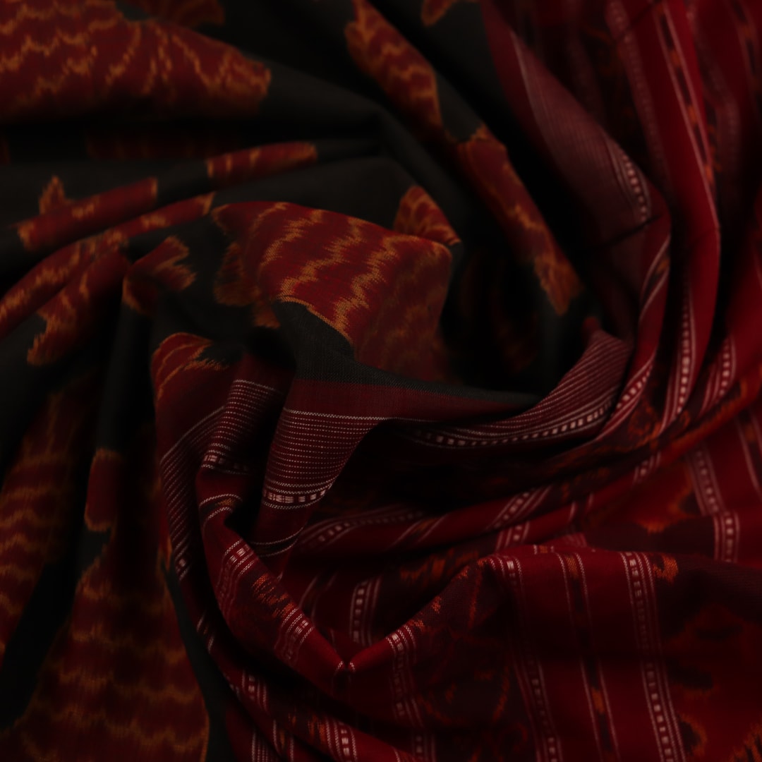 Green and maroon Sambalpuri cotton saree with intricate motifs