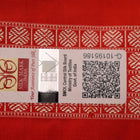 Close-up of finely woven silk fabric featuring intricate Butta patterns in multicolor with an orange accent