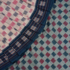 Styling view of a model draped in a white and blue Sambalpuri cotton saree with motif patterns