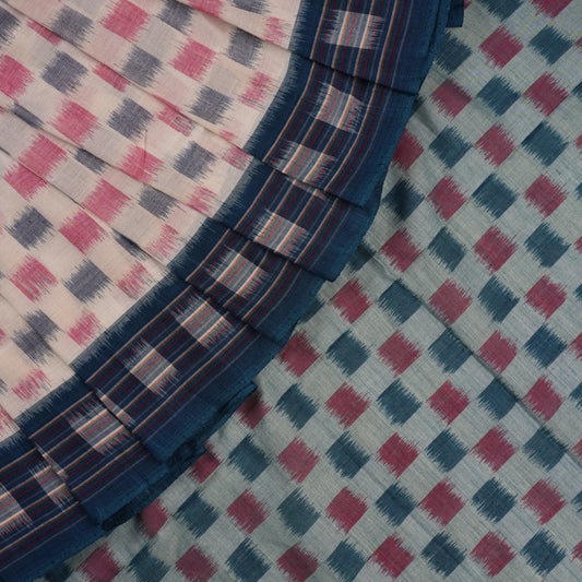 Styling view of a model draped in a white and blue Sambalpuri cotton saree with motif patterns