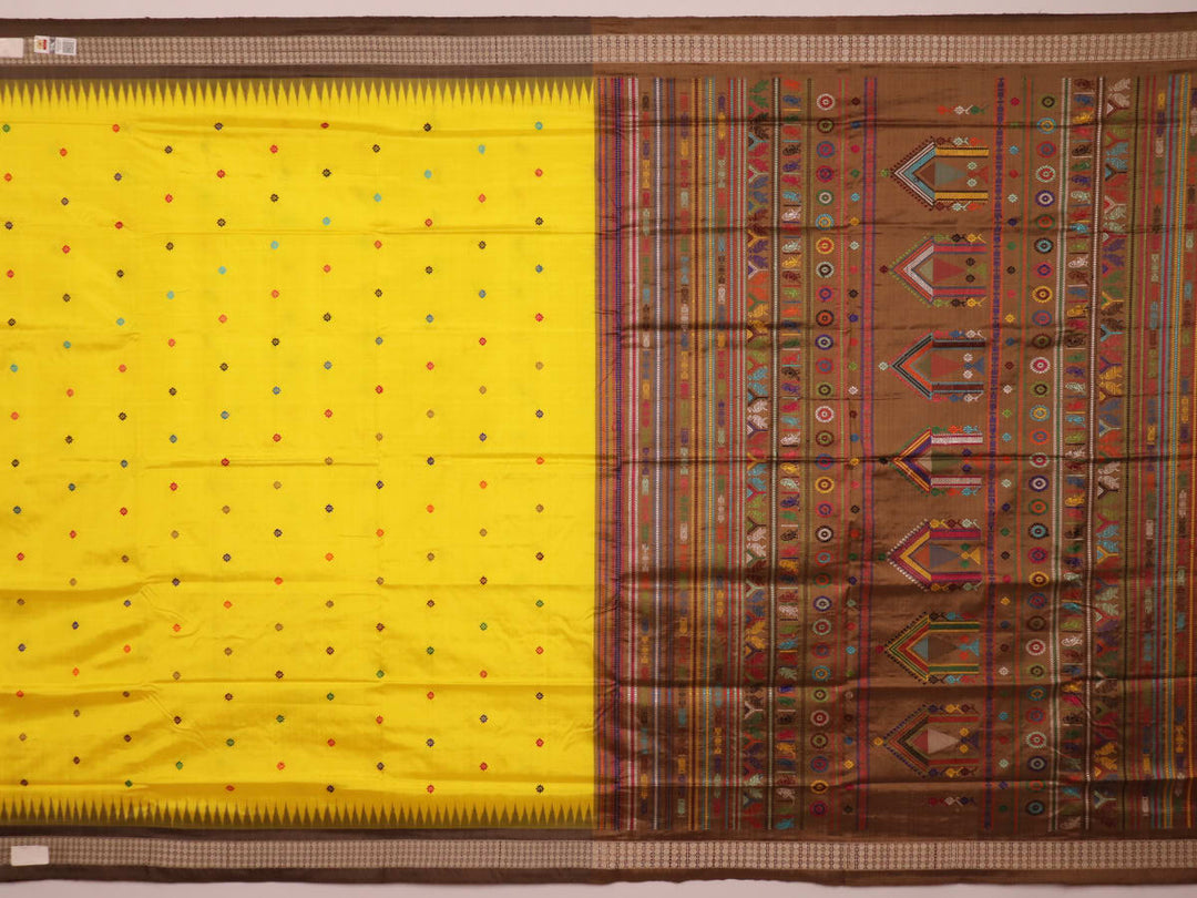 Close-up of Yellow and Brown Silk Saree fabric with Butta pattern