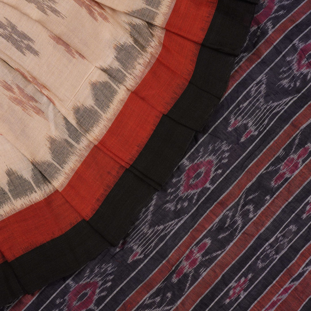 Full styling of a cream and black Sambalpuri cotton saree with traditional motifs on a model.