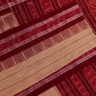 Draped plain cream and maroon Sambalpuri cotton saree.