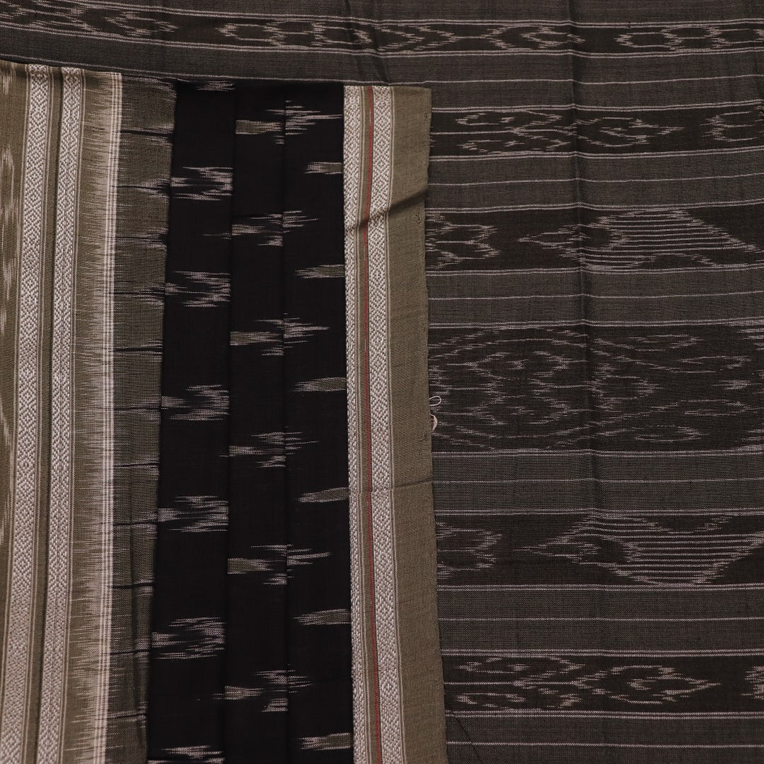 Saree styled; black Sambalpuri cotton saree with grey motifs showcased in a draped presentation.